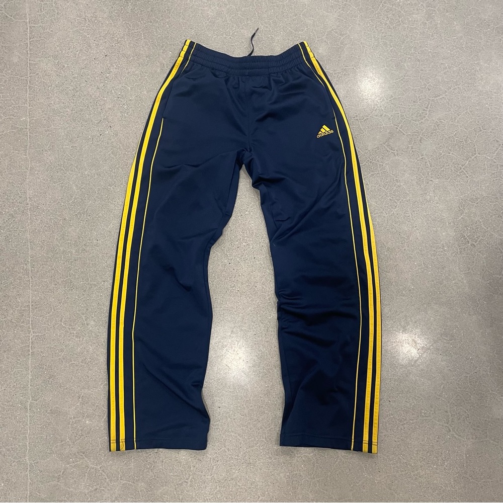 Navy and yellow adidas pants